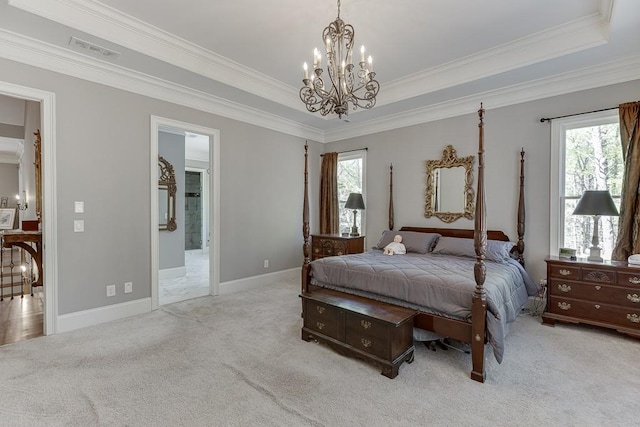 bedroom featuring a chandelier, carpet, visible vents, and multiple windows