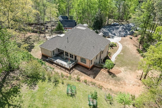 drone / aerial view featuring a view of trees