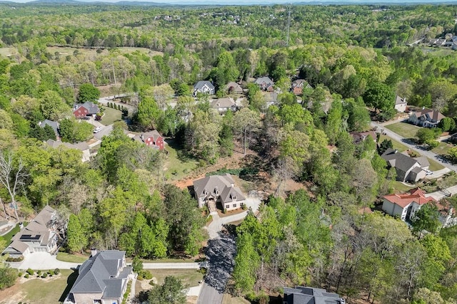 bird's eye view featuring a residential view and a forest view