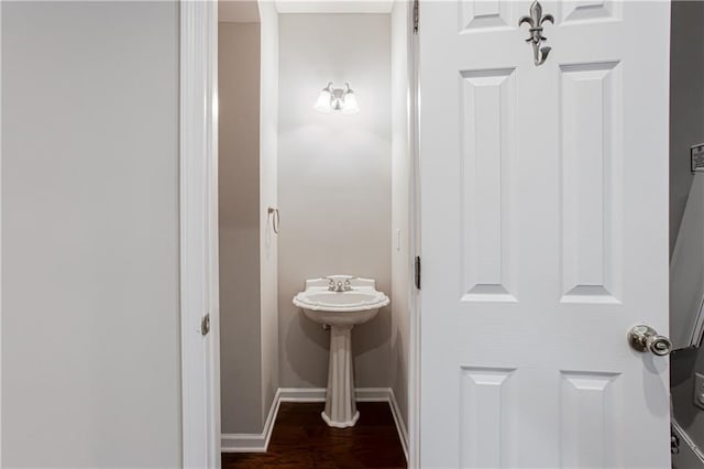 bathroom with hardwood / wood-style flooring