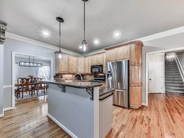 5090 Eubanks Rd, Woodstock, GA 30188 - kitchen with stainless steel appliances, a breakfast bar area, ornamental molding, light wood-type flooring, and decorative backsplash