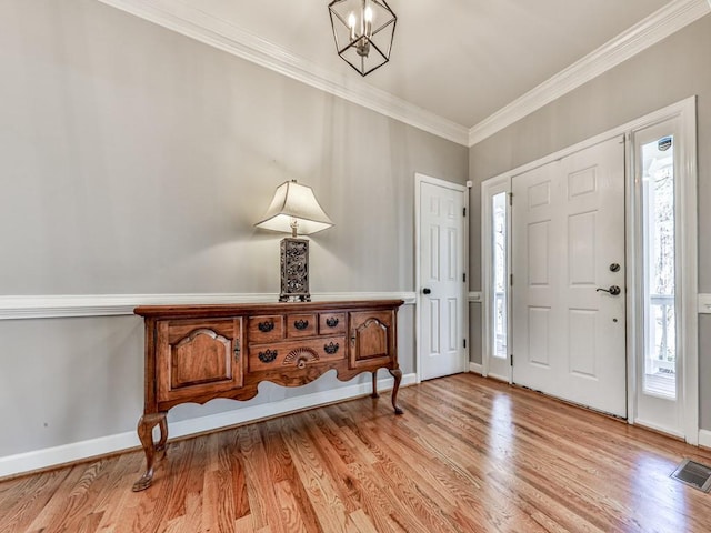 5090 Eubanks Rd, Woodstock, GA 30188 - foyer entrance with ornamental molding, healthy amount of natural light, light wood-type flooring, and baseboards