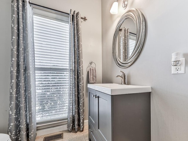 5090 Eubanks Rd, Woodstock, GA 30188 - bathroom with vanity and tile patterned flooring