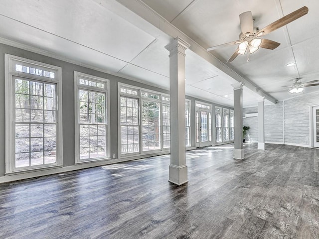 5090 Eubanks Rd, Woodstock, GA 30188 - unfurnished living room with ornate columns, ceiling fan, wood finished floors, crown molding, and beam ceiling