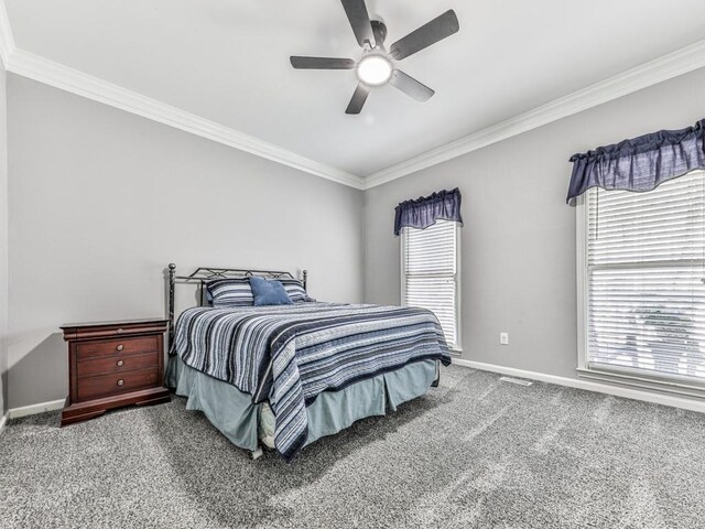 5090 Eubanks Rd, Woodstock, GA 30188 - carpeted bedroom featuring crown molding, multiple windows, baseboards, and ceiling fan