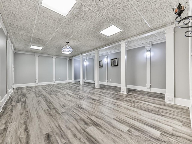 5090 Eubanks Rd, Woodstock, GA 30188 - below grade area featuring wood finished floors, baseboards, and a drop ceiling