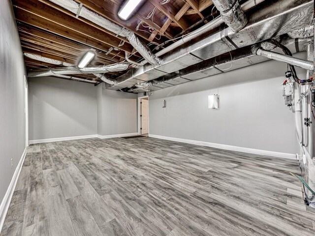 5090 Eubanks Rd, Woodstock, GA 30188 - basement featuring wood finished floors and baseboards