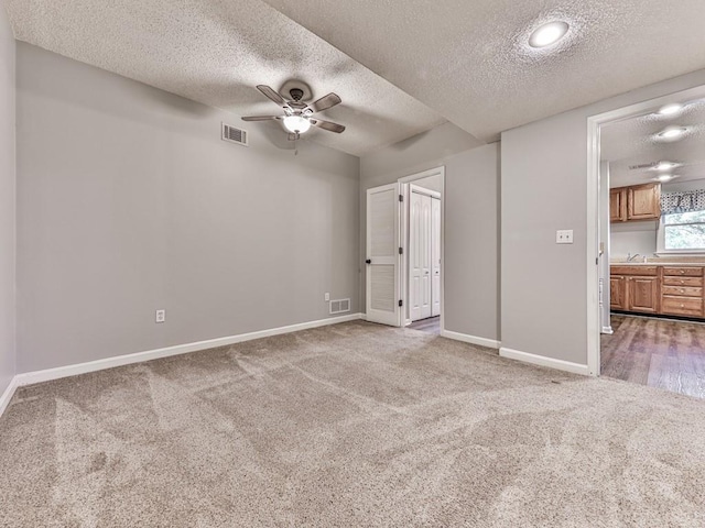 5090 Eubanks Rd, Woodstock, GA 30188 - unfurnished bedroom with carpet flooring, a textured ceiling, baseboards, and a sink