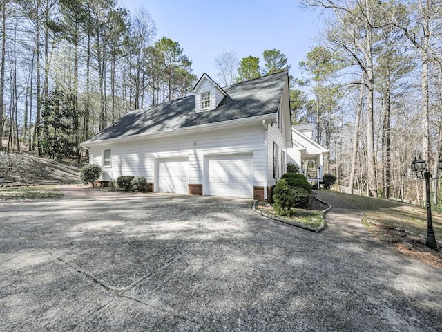 5090 Eubanks Rd, Woodstock, GA 30188 - view of side of property with an attached garage and concrete driveway
