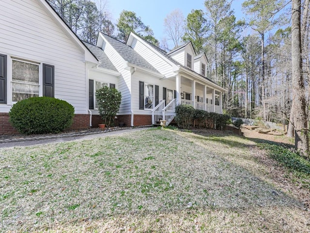 5090 Eubanks Rd, Woodstock, GA 30188 - view of side of property featuring a porch, a yard, and a shingled roof