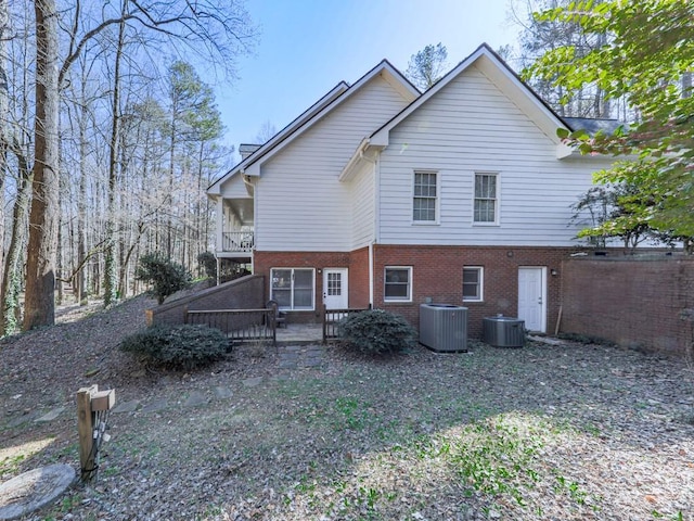 5090 Eubanks Rd, Woodstock, GA 30188 - view of side of property with central air condition unit, a balcony, and brick siding