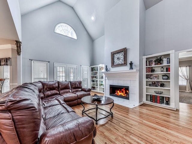 5090 Eubanks Rd, Woodstock, GA 30188 - living room with high vaulted ceiling, a fireplace, and wood finished floors