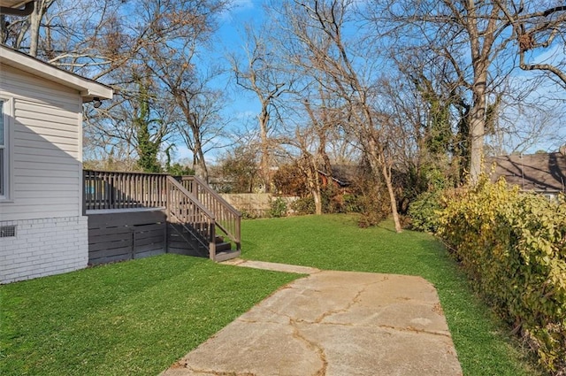 view of yard with a deck