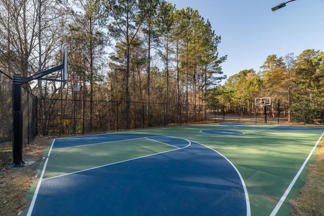 view of sport court with community basketball court and fence