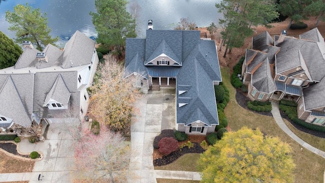 birds eye view of property with a water view