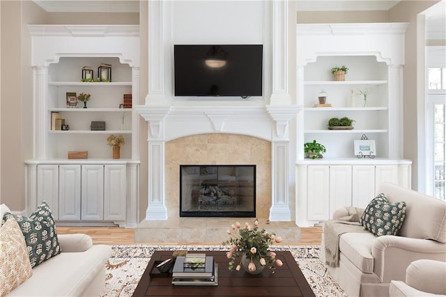 6191 Talmadge Run, Acworth, GA 30101 - living room with crown molding, light wood-style floors, and a fireplace