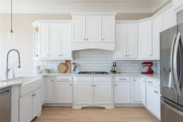 6191 Talmadge Run, Acworth, GA 30101 - kitchen with ornamental molding, white cabinetry, and appliances with stainless steel finishes