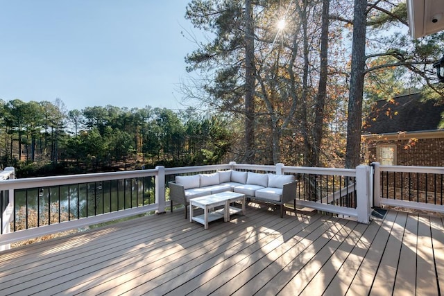 wooden terrace with outdoor lounge area