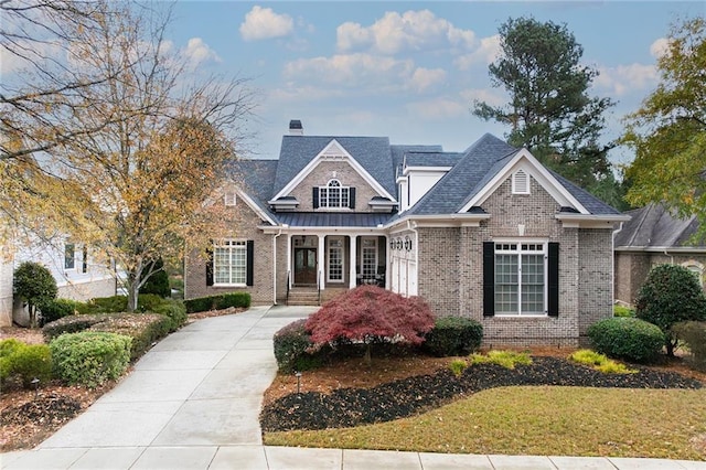 6191 Talmadge Run, Acworth, GA 30101 - craftsman-style house featuring brick siding, a shingled roof, and covered porch