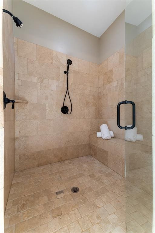 bathroom with a tile shower