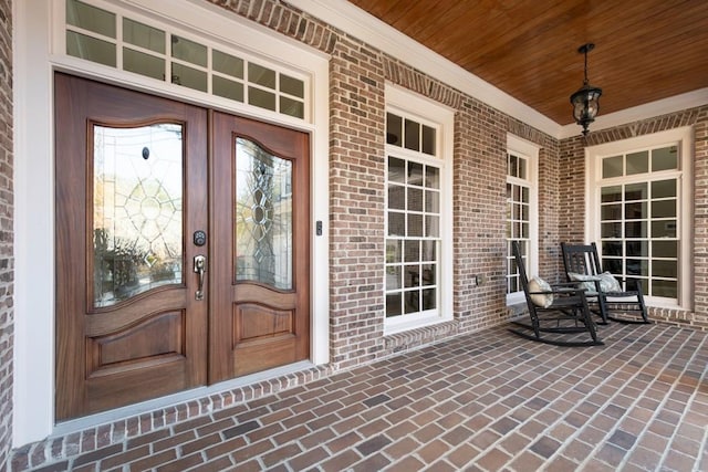 doorway to property with french doors and covered porch