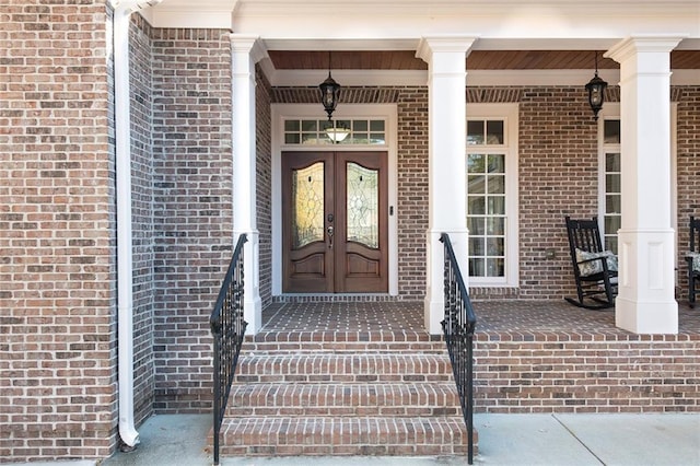 6191 Talmadge Run, Acworth, GA 30101 - entrance to property featuring french doors, covered porch, and brick siding