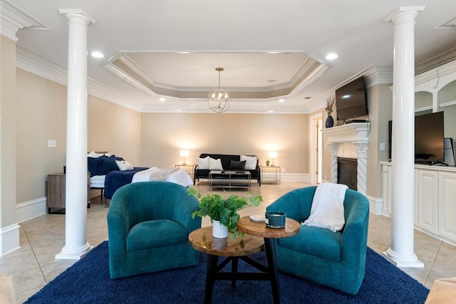 living area with light tile patterned flooring, a fireplace, crown molding, decorative columns, and a raised ceiling