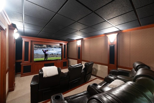 home theater with a paneled ceiling and light colored carpet