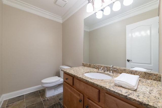 bathroom with vanity, toilet, and ornamental molding