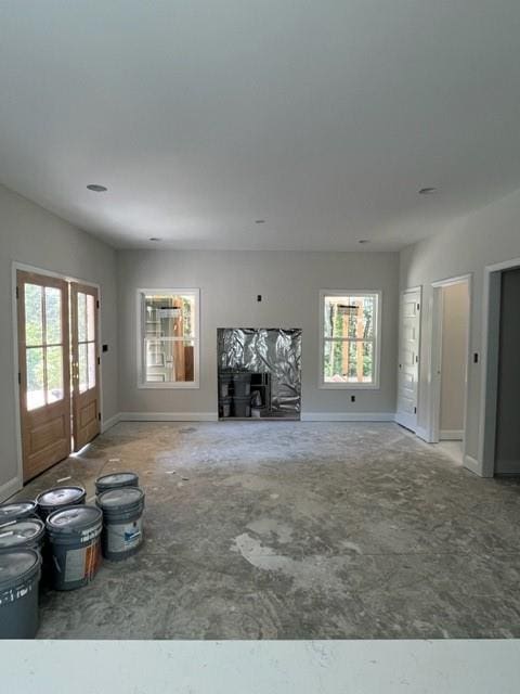 unfurnished living room with a wealth of natural light