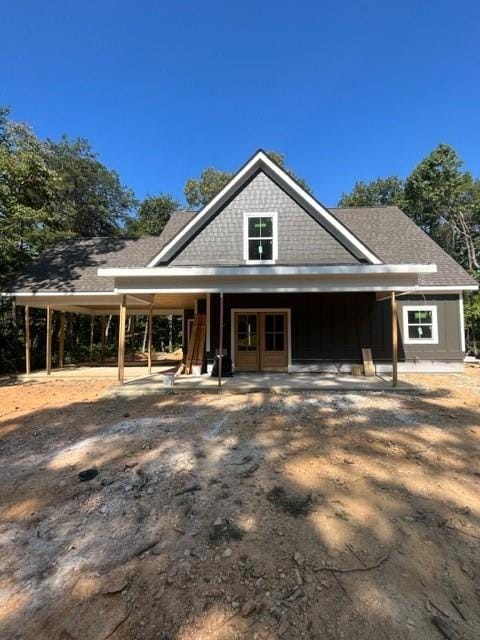 view of front of property featuring a carport