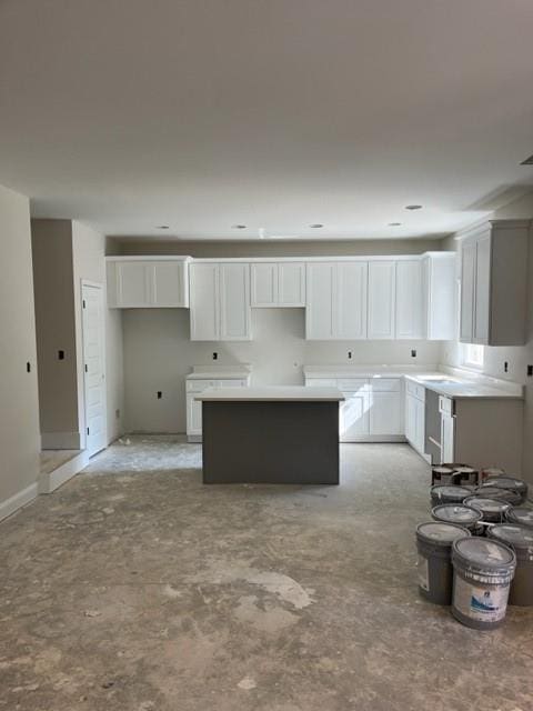 kitchen with white cabinets and a center island