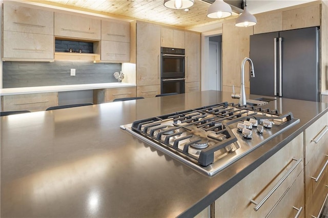 kitchen with pendant lighting, sink, black appliances, wooden ceiling, and light brown cabinets