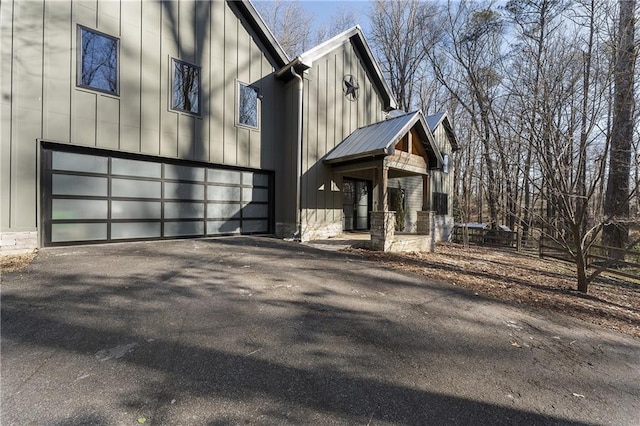 view of side of home with a garage