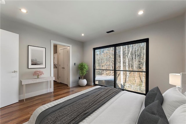 bedroom featuring dark wood-type flooring