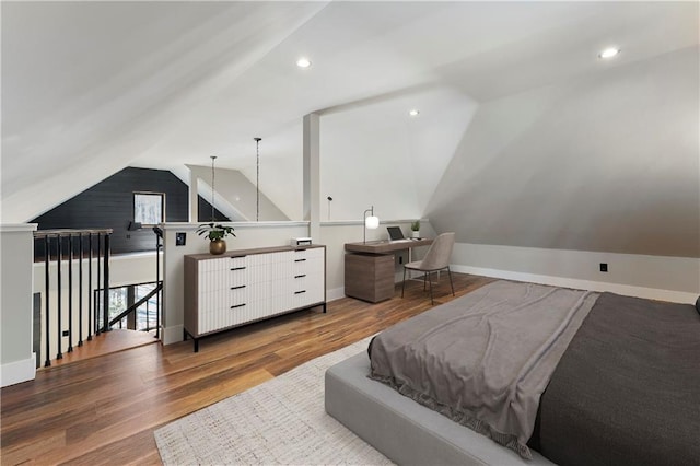 bedroom featuring hardwood / wood-style floors and vaulted ceiling