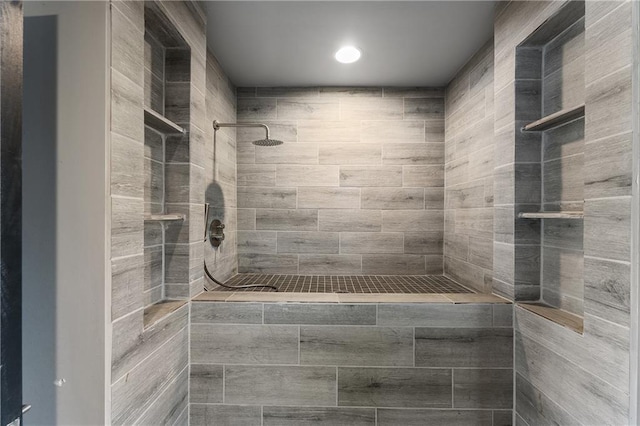 bathroom with tiled shower