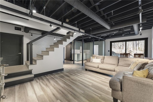 living room featuring hardwood / wood-style floors and track lighting