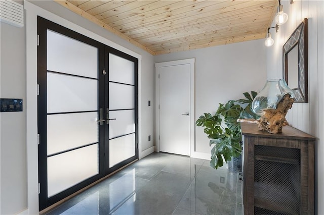 entryway with wood ceiling and french doors