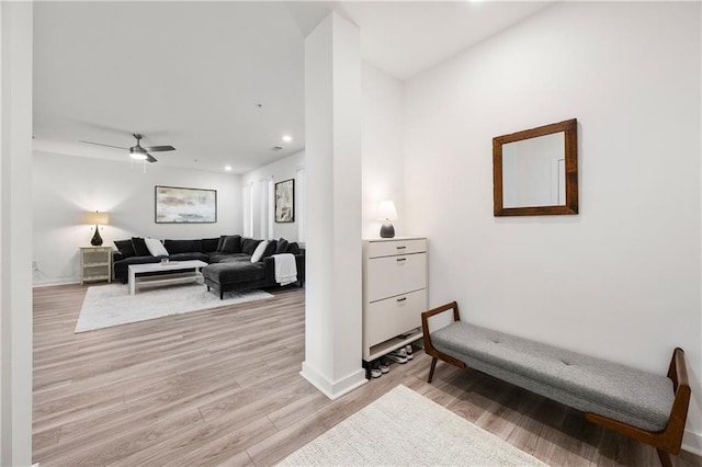 interior space featuring recessed lighting, light wood-type flooring, baseboards, and ceiling fan