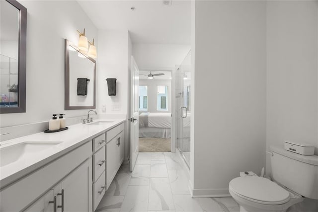 full bathroom with marble finish floor, toilet, and a sink