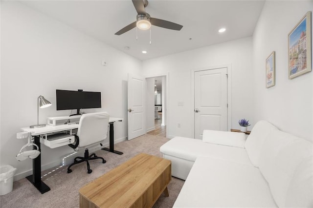 carpeted office space featuring recessed lighting, baseboards, and ceiling fan