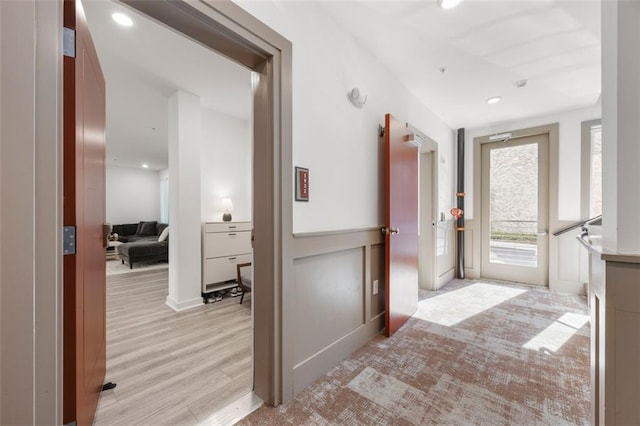 corridor with recessed lighting and light wood finished floors