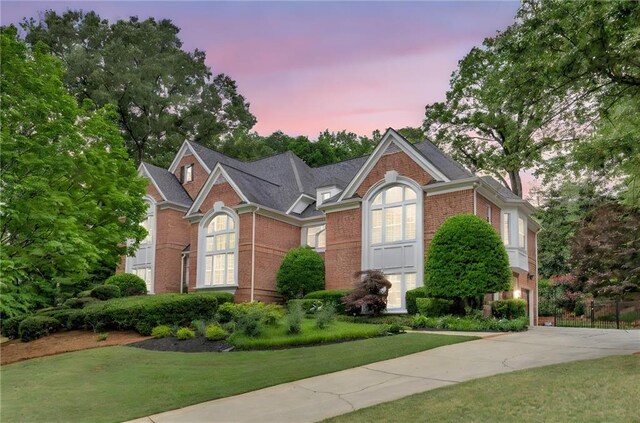 452 Brushstroke Ct SE, Marietta, GA 30067 - view of front facade with brick siding, a front lawn, and concrete driveway
