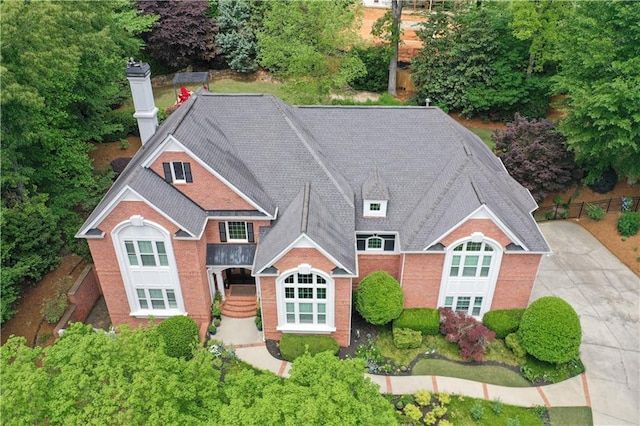 452 Brushstroke Ct SE, Marietta, GA 30067 - view of front facade featuring a chimney, brick siding, and concrete driveway