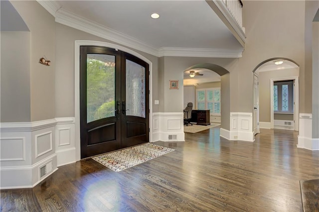 452 Brushstroke Ct SE, Marietta, GA 30067 - entryway with french doors, wood finished floors, a decorative wall, crown molding, and a wainscoted wall