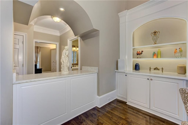 452 Brushstroke Ct SE, Marietta, GA 30067 - bar area featuring crown molding, dark wood finished floors, and baseboards