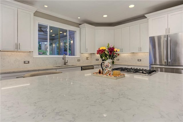 452 Brushstroke Ct SE, Marietta, GA 30067 - kitchen with appliances with stainless steel finishes, a sink, white cabinetry, light stone countertops, and recessed lighting