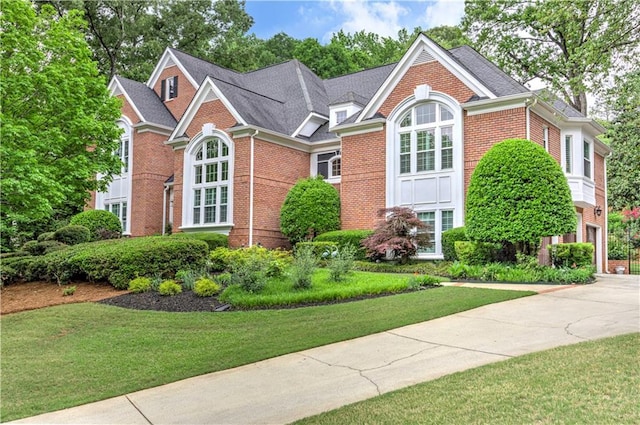 452 Brushstroke Ct SE, Marietta, GA 30067 - view of front facade with brick siding, driveway, and a front lawn