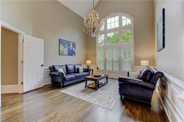 452 Brushstroke Ct SE, Marietta, GA 30067 - living area with high vaulted ceiling, a chandelier, and wood finished floors